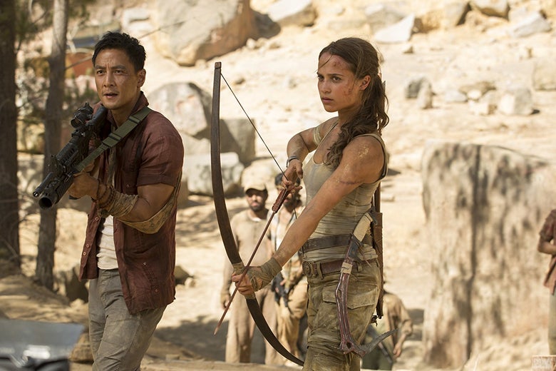Lu Ren (Daniel Wu) and Lara Croft (Alicia Vikander) wield their weapons in Tomb Raider.